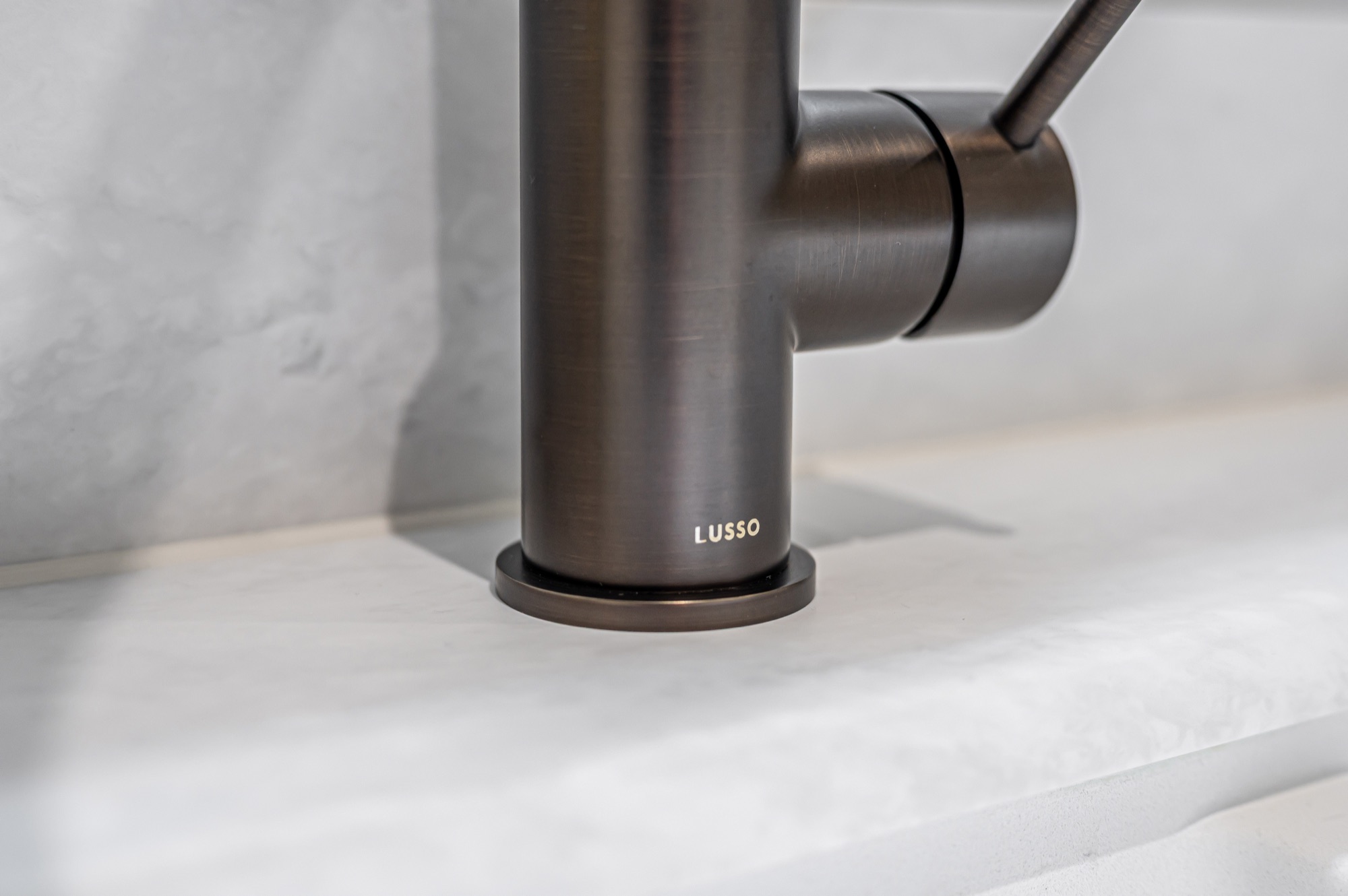 Close-up of a gunmetal kitchen tap