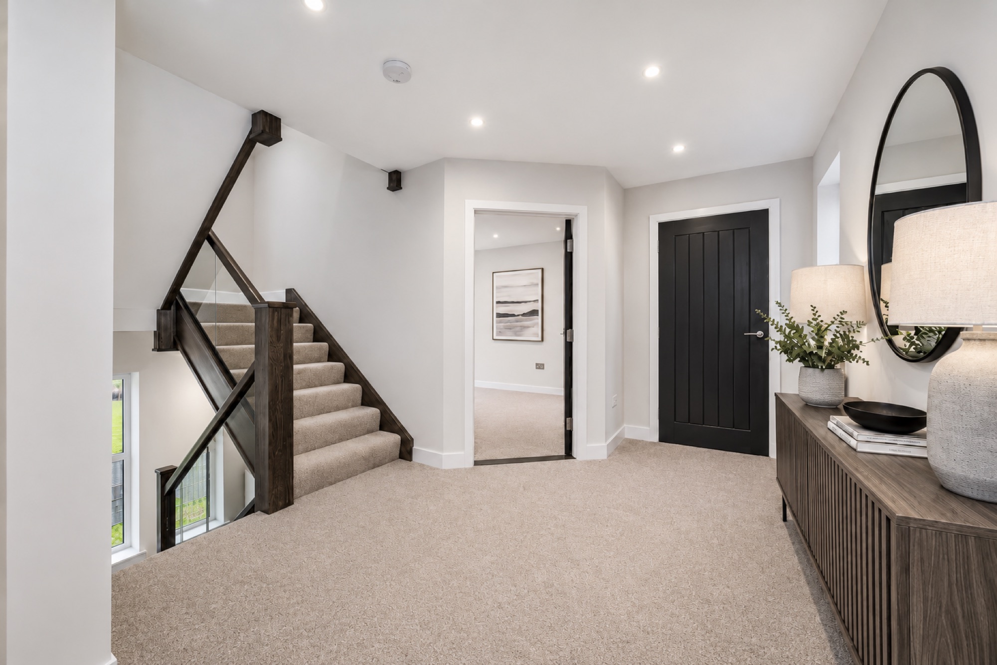 Hand-built oak staircase and landing with smoked glass balustrade